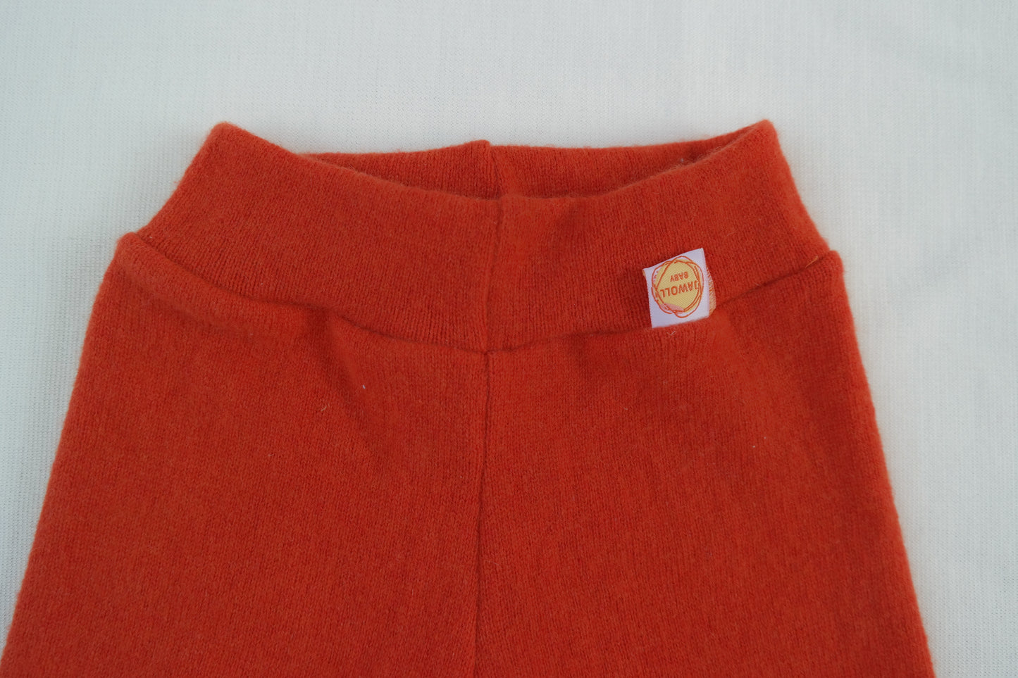 Growing pants for babies and toddlers 74/80 made from 100% upcycled cashmere in coral orange