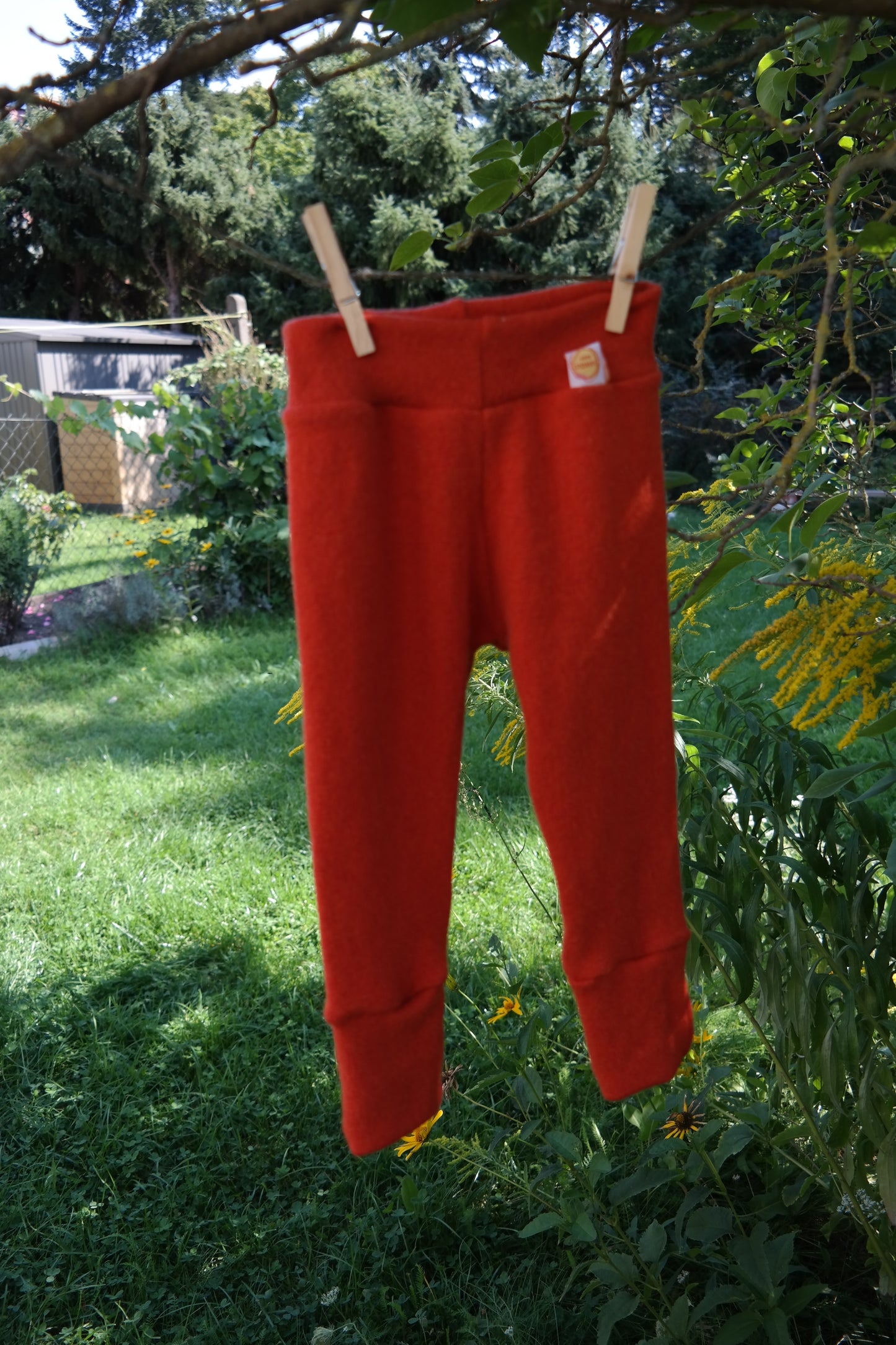 Growing pants for babies and toddlers 74/80 made from 100% upcycled cashmere in coral orange