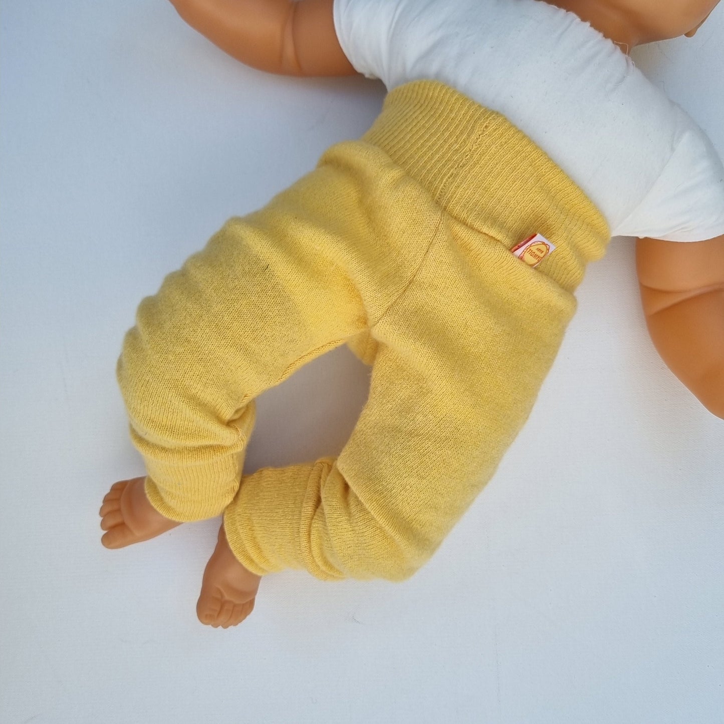 Grow-along trousers 62/68 made from upcycled wool in pastel yellow